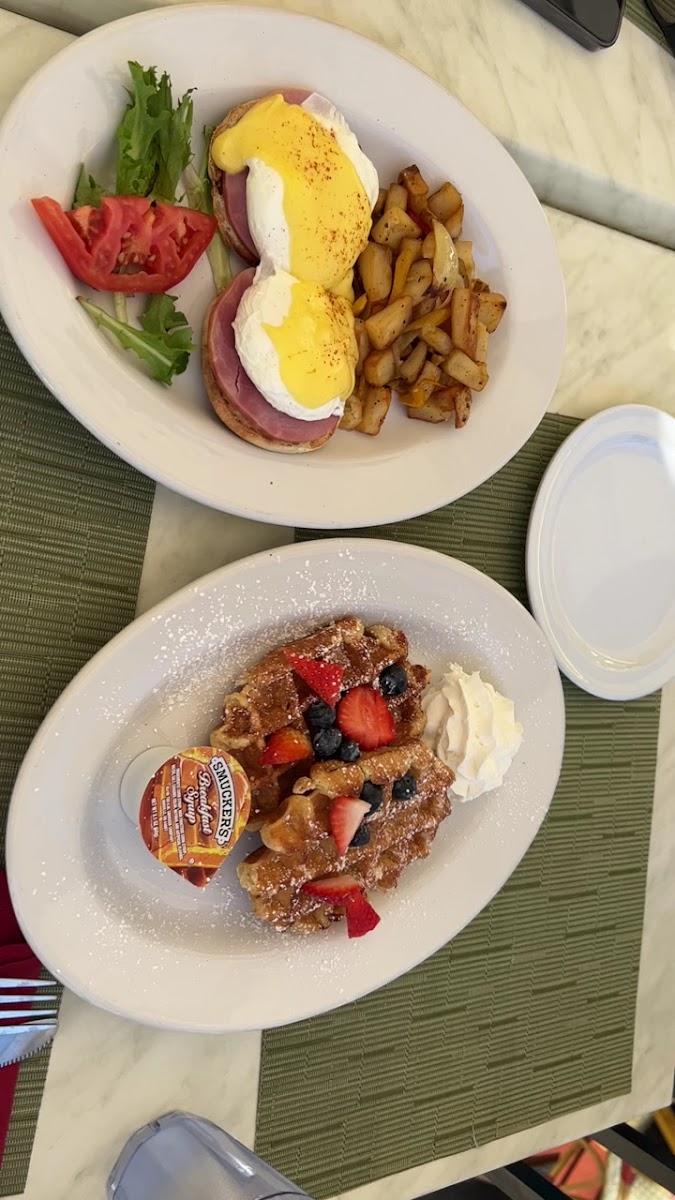 Plated breakfast with eggs and waffles